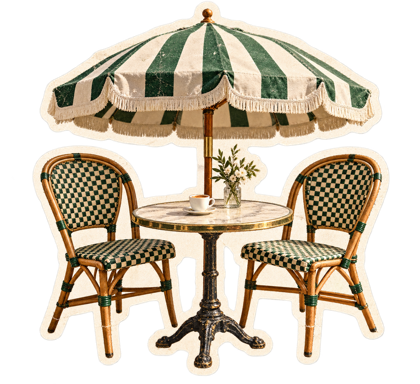 Bistro cafe table and chairs beneath a parasol.